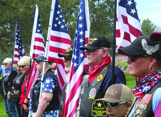 Members of the Patriot Guard Riders hold flags at Monday’s Memorial Day Service at the Northern Nevada Veterans Memorial Cemetery in Fernley.