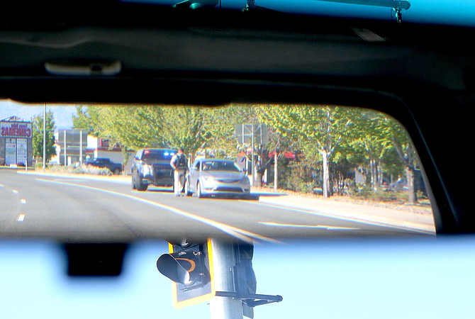 A Douglas County Sheriff's deputy conducts a traffic stop in Minden on May 9.