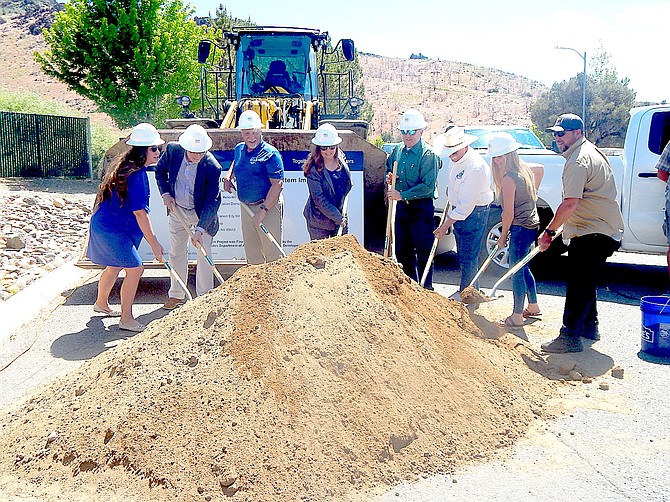 Officials from the U.S. Department of Agriculture, Pine View Homeowners Association, Minden-Gardnerville Sanitation District and Douglas County participated in a groundbreaking June 3 for a sewer line and lift station to serve the Pine Nut Mountain neighborhood.