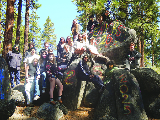 Whittell High School seniors pose on “Senior Rock” at the high school on May 20.