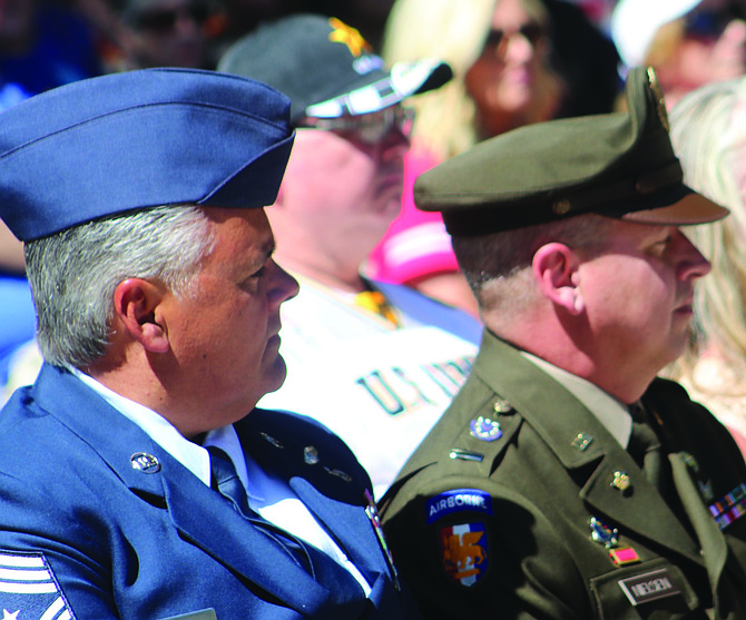 Command Chief Master Sgt. Cameron M. Pieters, left, Nevada Guard Senior Enlisted Leader, and State Command Chief Warrant Officer 5 Steve Nielsen, listen to the speakers during Saturday’s annual Flag Day and U.S. Army birthday celebration.