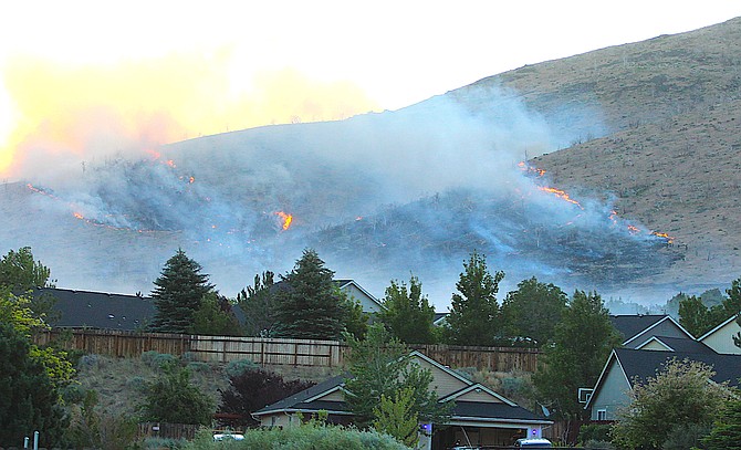 A line of flames burns up the mountain above Pine View Estates on Friday morning.