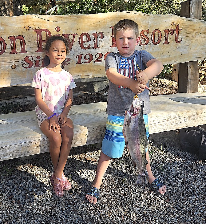 Santa Cruz 7-year-old Jendrik Potkin holds a 3.6-pound fish he caught in Markleeville Creek. Cousin Cleo Potenzone looks on.
Carson River Resort photo