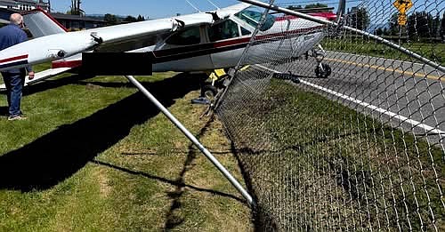 The pilot of a Cessna 177 Cardinal private plane landed late on Harvey Field’s runway before crashing into the fence at the end of the airport property Wednesday, May 28, 2025, according to the FAA’s preliminary summary of the incident. The tail number, similar to a vehicle's license plate, has been blotted over by the Tribune.