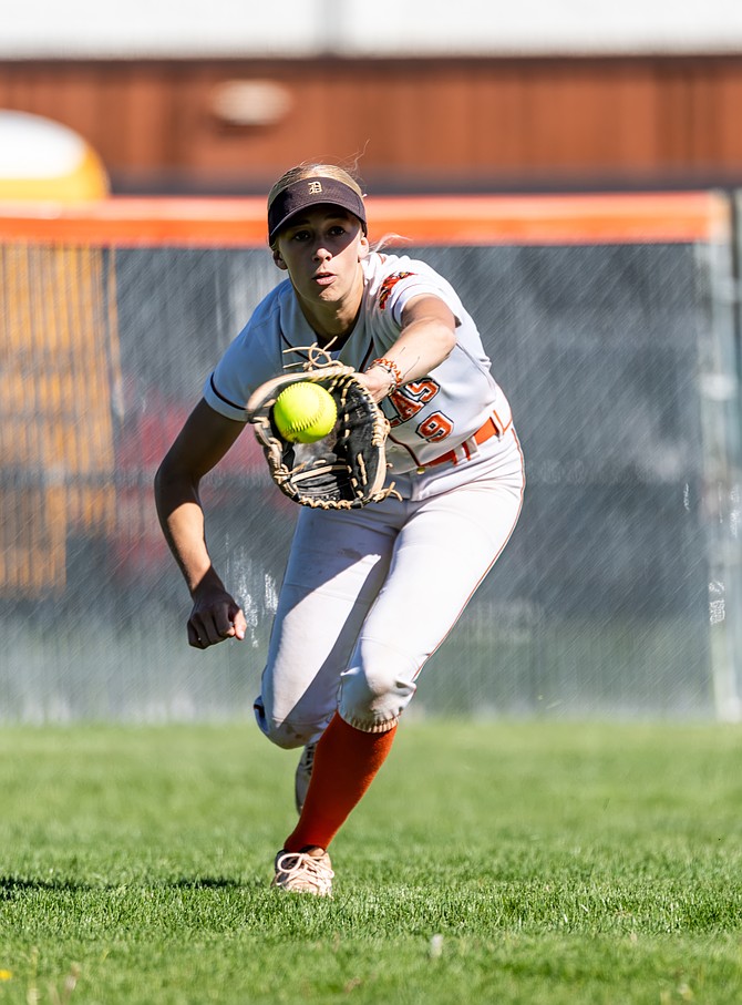 Douglas’ Cam McLelland reaches out to make a catch in the outfield this season. McLelland was named the Class 5A North all-league player of the year for her performance this season in a Tiger uniform.