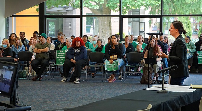 Early Learning Center parent and attorney Samantha Sommerman speaks to an audience who were largely against the Early Learning Center’s closure at the June 25 EvCC board meeting.