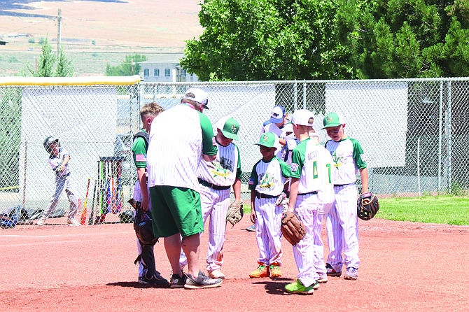 The Battle Mountain infield meets with coaches during it's game with White Pine at the District 3 Tournament in Winnemucca.