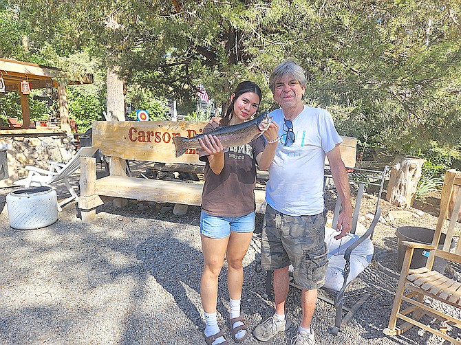 Elizabeth Alspaw and father Robert at the Carson River Resort with a 3.14-pound rainbow trout they pulled from the East Fork of the Carson River.
