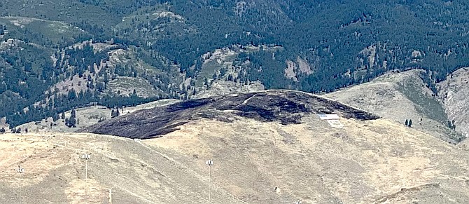 Evidence of the wildfire on C Hill that started Friday night is visible Saturday morning in Carson City.