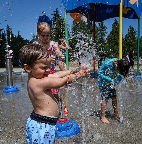 Jordy, age 2 from Lake Stevens, and pals enjoy the water and the weather at the splash pad at Willis D. Tucker Community Park near Snohomish Wednesday, July 2. Splash pads are open for water play and cooling off. The one at Willis Tucker Park (6705 Puget Park Drive) is open daily 10 a.m. to 7 p.m. until Labor Day weekend. Another splash pad is at Everett’s Forest Park, 802 E. Mukilteo Boulevard, from 11 a.m. to 8 p.m.