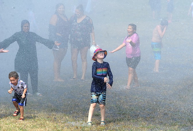 Kids and adults play during the inaugural Fire Sprinkler Days in 2023.
