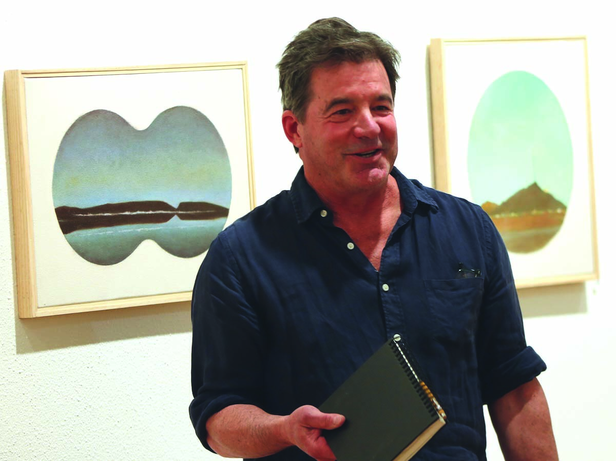 Artist views the Great Basin through binoculars