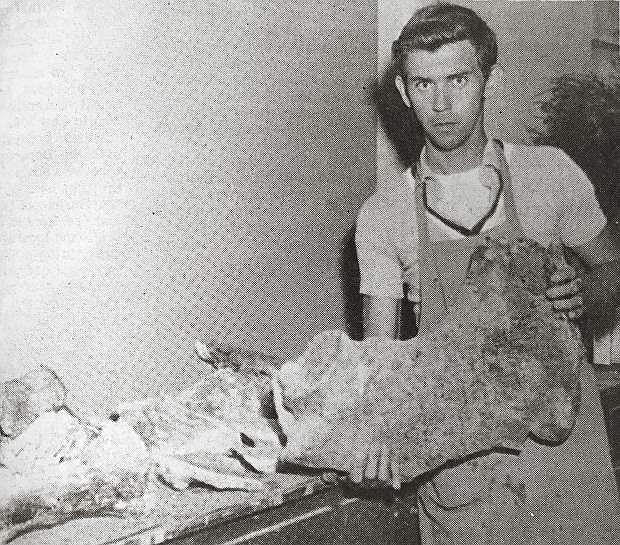DAVID GRAY of the Nevada State Museum holds the 30-pound mastodon bone, which he says may be as old as one million years, found recently 20 miles north of Lovelock by Ben Hunt of Winnemucca. A number of other pieces were found at the site also, and are now being prepared for exhibition at the museum.