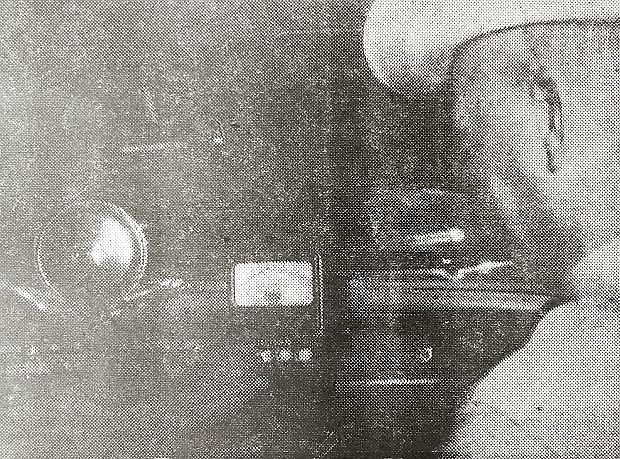 Sheriff Howard Hoffman watches as Chief Deputy Marshal Robert Humphrey clocks a car at 60 mph on the new radar set installed in Carson police cars. Speed is read on the main gauge; the disc to the right has two prongs in front which supply the signal. Speed can be determined in any direction by turning the prongs.