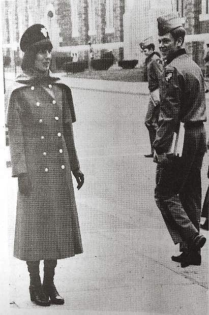 Model Jane Thacker catches attention at West Point in the overcoat, beret and boots that will be the cold weather full dress for the 80-100 female cadets expected to attend the U.S. Military Academy in 1976. This will be the first class including women at West Point, ending a men-only tradition of 174 years.