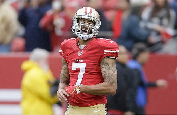 FILE - In this Nov. 8, 2015, file photo, San Francisco 49ers quarterback Colin Kaepernick (7) warms up before an NFL football game against the Atlanta Falcons in Santa Clara, Calif. The The 49ers announced Saturday, Nov. 21, 2015, that they placed Kaepernick on the injured reserve list. (AP Photo/Ben Margot, File)