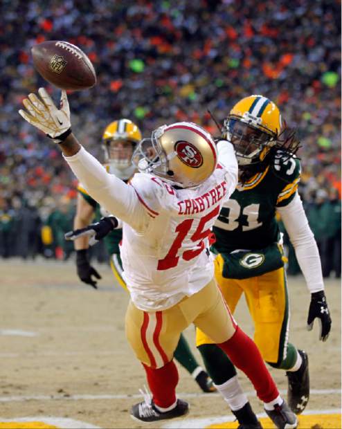 San Francisco 49ers Michael Crabtree (15) is pursued by New