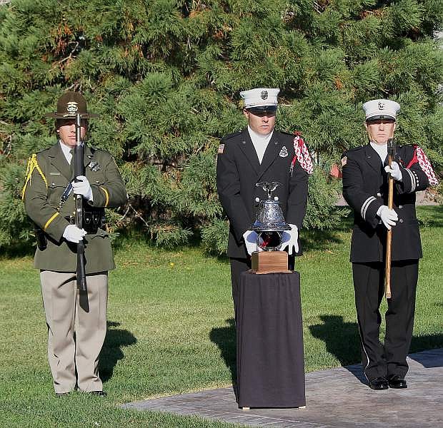 The Carson City Fire Department and Sheriff&#039;s Office Honor Guard ring the bell next to the Twin Towers I-beam Sunday morning. Each ring symbolizes each tragic event of Sept. 11.