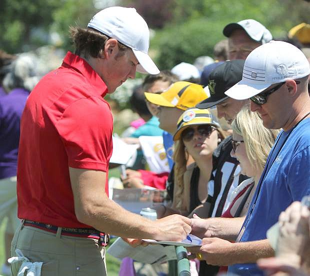 T.J. Oshie signs an autograph for a fan following the first round of the American Century Championship on Friday.