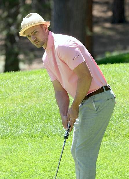 Justin Timberlake watches the roll of his putt on the third green at Edgewood Tahoe Golf Course on Tuesday.