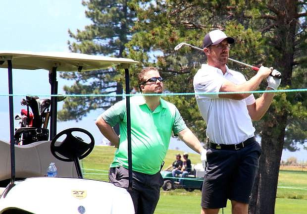 Kansas City Chiefs quarterback Alex Smith watches his approach shot during Wednesday&#039;s Lake Tahoe Celebrity-Am Tournament at Edgewood Tahoe Golf Course.