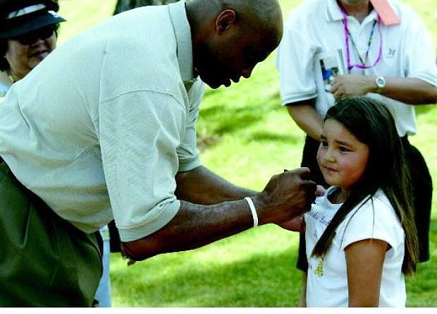 Charles Barkley signs an autograph at a previous American Century Championship. South Lake Tahoe native Preston Garrison will never forget his afternoon spent with  Barkley some 20 years ago.