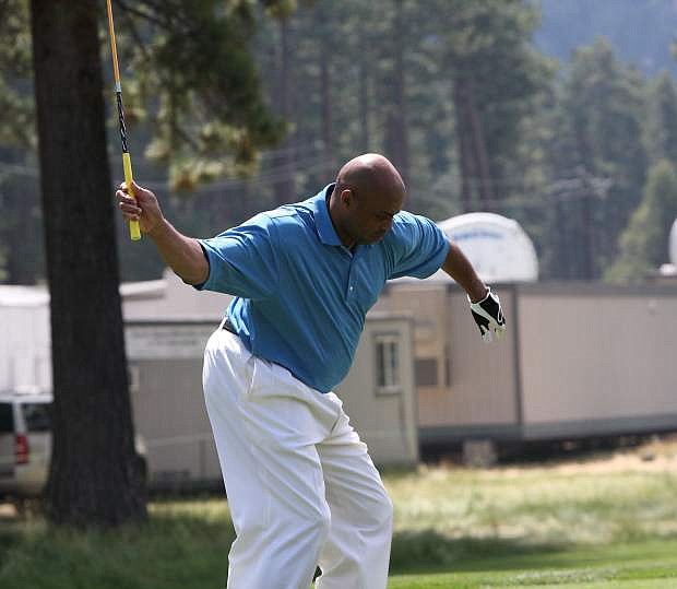 Charles Barkley tees off with one hand at hole 18 during the final day of last year&#039;s American Century Championship. Barkley enters this year&#039;s tournament with 5,000-to-1 odds to finish atop the leaderboard.