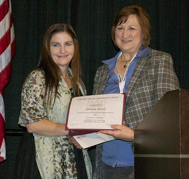 The Nevada Agricultural Foundation (NAF) awarded Kristina Moore, left, with the Nevada Ag in the Classroom Volunteer of the Year Awardin November  during the Nevada Farm Bureau 95th annual meeting in Reno. The award was presented by the NAF Executive Director Sue Hoffman.