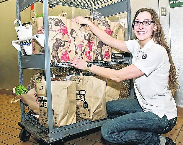 Nevada Volunteers Co-Director Diedre Ledford, a former AmeriCorps volunteer, sorts bags for Project Mana, a food bank in Incline/Kings Beach.