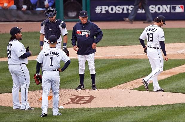 Detroit Tigers starting pitcher Anibal Sanchez (19) is pulled by manager Jim Leyland, center right, during the fifth inning of Game 3 of an American League baseball division series against the Oakland Athletics in Detroit, Monday, Oct. 7, 2013. (AP Photo/Charles Rex Arbogast)