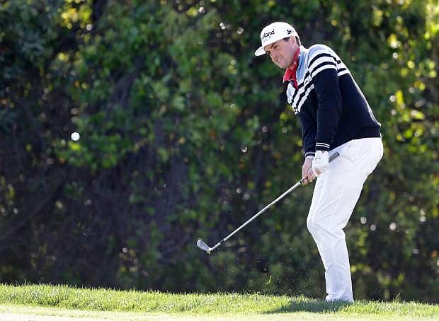 Keegan Bradley hits chip shot to the sixth hole during the final round of the Arnold Palmer Invitational golf tournament, Monday, March 25, 2013, in Orlando, Fla. (AP Photo/John Raoux)