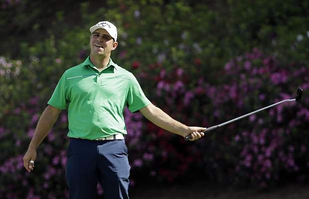 Gary Woodland reacts after missing an eagle on the 13th hole during the second round of the Masters golf tournament Friday, April 11, 2014, in Augusta, Ga. (AP Photo/David J. Phillip)