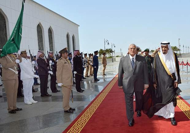 In this photo released by the Saudi Press Agency, Defense Minister and Saudi Crown Prince Salman bin Abdul-Aziz, right, welcomes Egyptian interim President Adly Mansour on his arrival to the airport in Jiddah, Saudi Arabia, Monday, Oct. 7, 2013. Egypt&#039;s interim president has landed in Saudi Arabia for his first foreign trip since assuming power after the ouster of the country&#039;s Islamist president. (AP Photo)