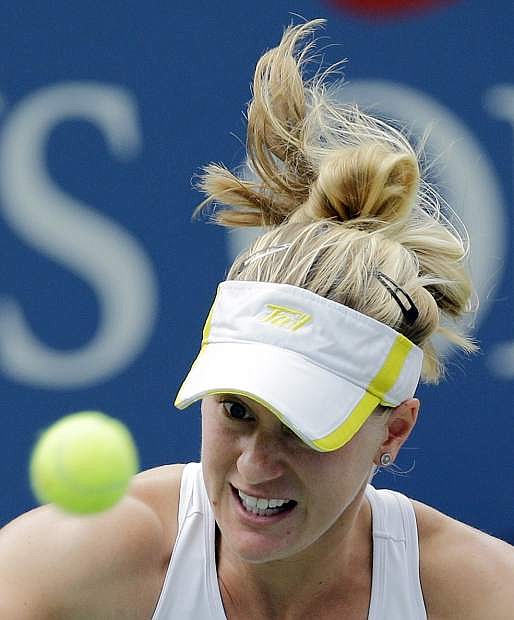 Alison Riske returns a shot against Daniela Hantuchova, of Slovakia, during the fourth round of the 2013 U.S. Open tennis tournament, Monday, Sept. 2, 2013, in New York. (AP Photo/Mike Groll)