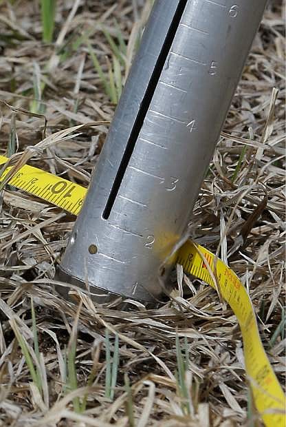 The snow pack measuring tube and tape measure used by Frank Gehrke, chief of the California Cooperative Snow Surveys Program for the Department of Water Resources, is shown after the monthly snow survey&#039;s held near Echo Summit, Calif., Wednesday, April 1, 2015. Gehrke said this was the first time since he has been conducting the survey at that he found no snow at this location at this time of the year. (AP Photo/Rich Pedroncelli)