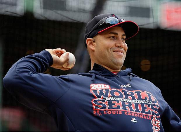 St. Louis Cardinals&#039; Carlos Beltran throws during batting practice for Game 1 of baseball&#039;s World Series against the Boston Red Sox Tuesday, Oct. 22, 2013, in Boston. (AP Photo/Matt Slocum)