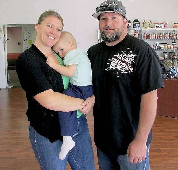J.D. and Brook Adie and their son Walker share time in the gym at Sierra Adrenaline Training Center.