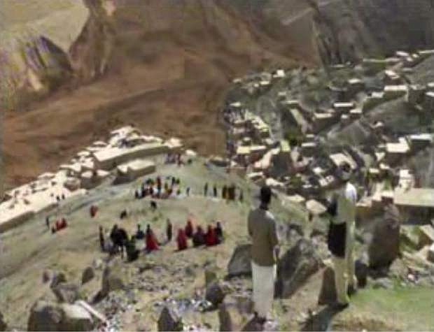 This image made from AP video shows people searching for survivors after a massive landslide landslide buried a village Friday, May 2, 2014 in Badakhshan province, northeastern Afghanistan, which Afghan and U.N. officials say left hundreds of dead and missing missing. (AP Photo via AP video)