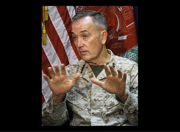 FILE - In this Aug. 10,  2013 file photo, Marine Gen. Joseph Dunford, who commands the U.S.-led International Security Assistance Force (ISAF), speaks during an interview at the ISAF headquarters in Kabul, Afghanistan. The top U.S. and coalition commander in Afghanistan expressed his deep regrets to Afghanistan&#039;s President Hamid Karzai over an allied airstrike that killed a child and injured two women, his spokesman said. (AP Photo/Ahmad Jamshid, File)