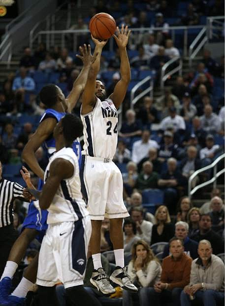 Nevada&#039;s Deonte Burton shoots over Air Force defender Justin Hammonds during Saturday&#039;s game.