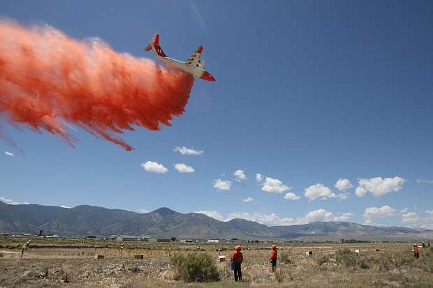 An air tanker drops a load of fire retardant during a grid test at the Minden-Tahoe airport on Tuesday.