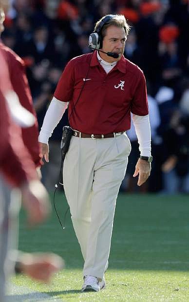 Alabama head coach Nick Saban watches from the sidelines during the first half of an NCAA college football game against Auburn in Auburn, Ala., Saturday, Nov. 30, 2013. (AP Photo/Dave Martin)
