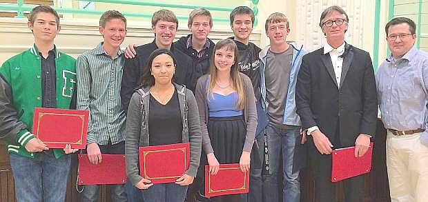 The trustees recognized the 19 member who were selected for the All State Choir at a board meeting. Back row from left are Eric Sabatino, Davis Koenig, Joseph Sorensen, Thomas Robertson, Justice Crowley, Nathan Schank, choir teacher Thomas Fleming and trustee Greg Koenig. Front row from left are Sabrina Jimenez and Alison James. Not pictured are Megan Rosario, Adia Sommer, Megan Housel, Melissa Coblentz, Alex Nelsen, Donald Granger, Eric Sorensen, Keenan Caillouette, Ethan Smith, Dustin Gross and Jacob Moulton.