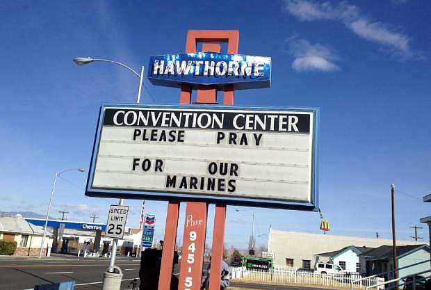 A Convention Center billboard asks people to pray for the Marines that will killed in Hawthorne, Nev. on Tuesday March 19, 2013.  Military officials say a mortar shell explosion killed seven Marines and injured a half-dozen more during a training exercise in Nevada&#039;s high desert. The accident prompted the Marine Corps to immediately halt use of some mortar shells until an investigation can determine its safety. (AP Photo/The Reno Gazette-Journal, Marilyn Newton)