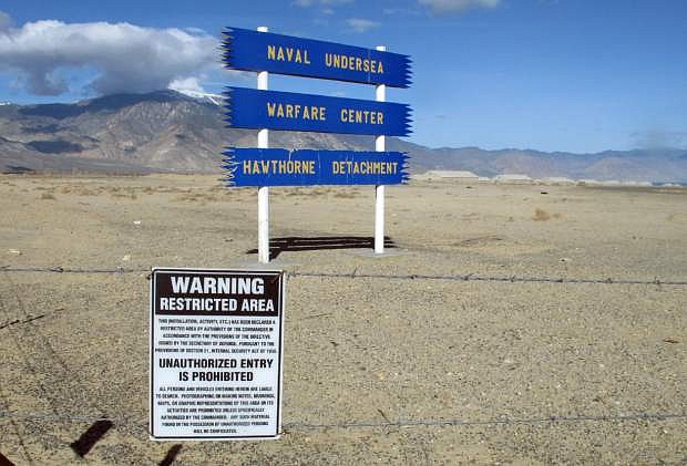 Signs are seen at the Hawthorne Army Depot on Tuesday, March 19, 2013, where seven Marines were killed and several others seriously injured in a training accident Monday night, about 150 miles southeast of Reno in Nevada&#039;s high desert. (AP Photo/Scott Sonner)
