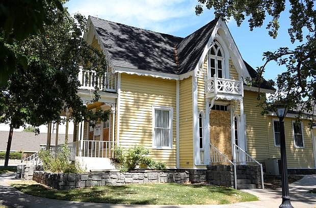 The Foreman-Roberts House on North Carson Street is boarded after two fires were deliberately set damaging the historic home.