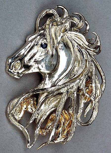Ghost Horse made of sterling silver, gold and precious stone.