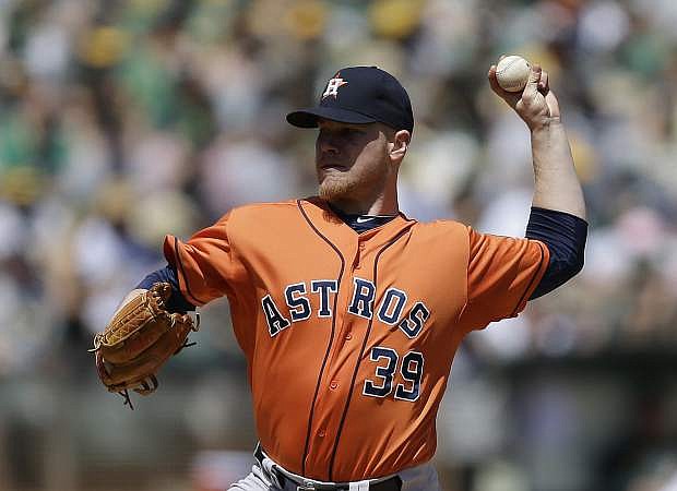 Houston Astros&#039; Brett Oberholtzer works against the Oakland Athletics in the first inning of a baseball game Saturday, April 19, 2014, in Oakland, Calif. (AP Photo/Ben Margot)