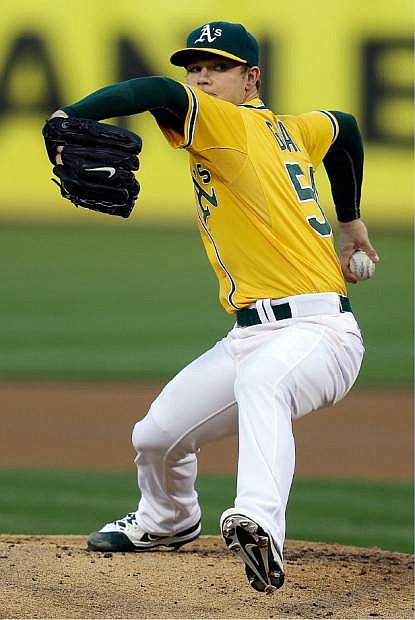 Oakland Athletics pitcher Sonny Gray works against the Houston Astros in the first inning of a baseball game Friday, April 18, 2014, in Oakland, Calif. (AP Photo/Ben Margot)