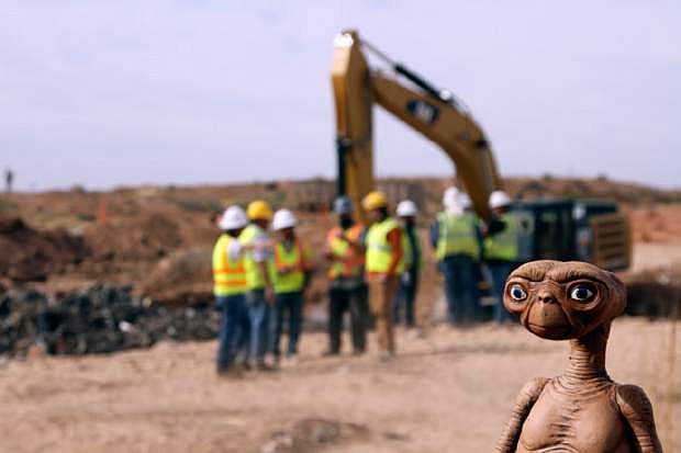 An E.T. doll is seen while construction workers prepare to dig into a landfill in Alamogordo, N.M., Saturday, April 26, 2014. Producers of a documentary are digging in the landfill in search of millions of cartridges of the Atari &#039;E.T. the Extra-Terrestrial&#039; game that has been called the worst game in the history of videogaming. A New York Times article from 1983 reported that Atari cartridges of &quot;E.T. The Extraterrestrial&quot; were dumped in the landfill in Alamogordo.  (AP Photo/Juan Carlos Llorca)